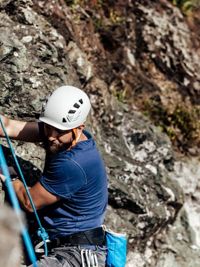 man-climbing-a-steep-rock-formation-with-climbing-2026-01-11-10-11-11-utc.jpg
